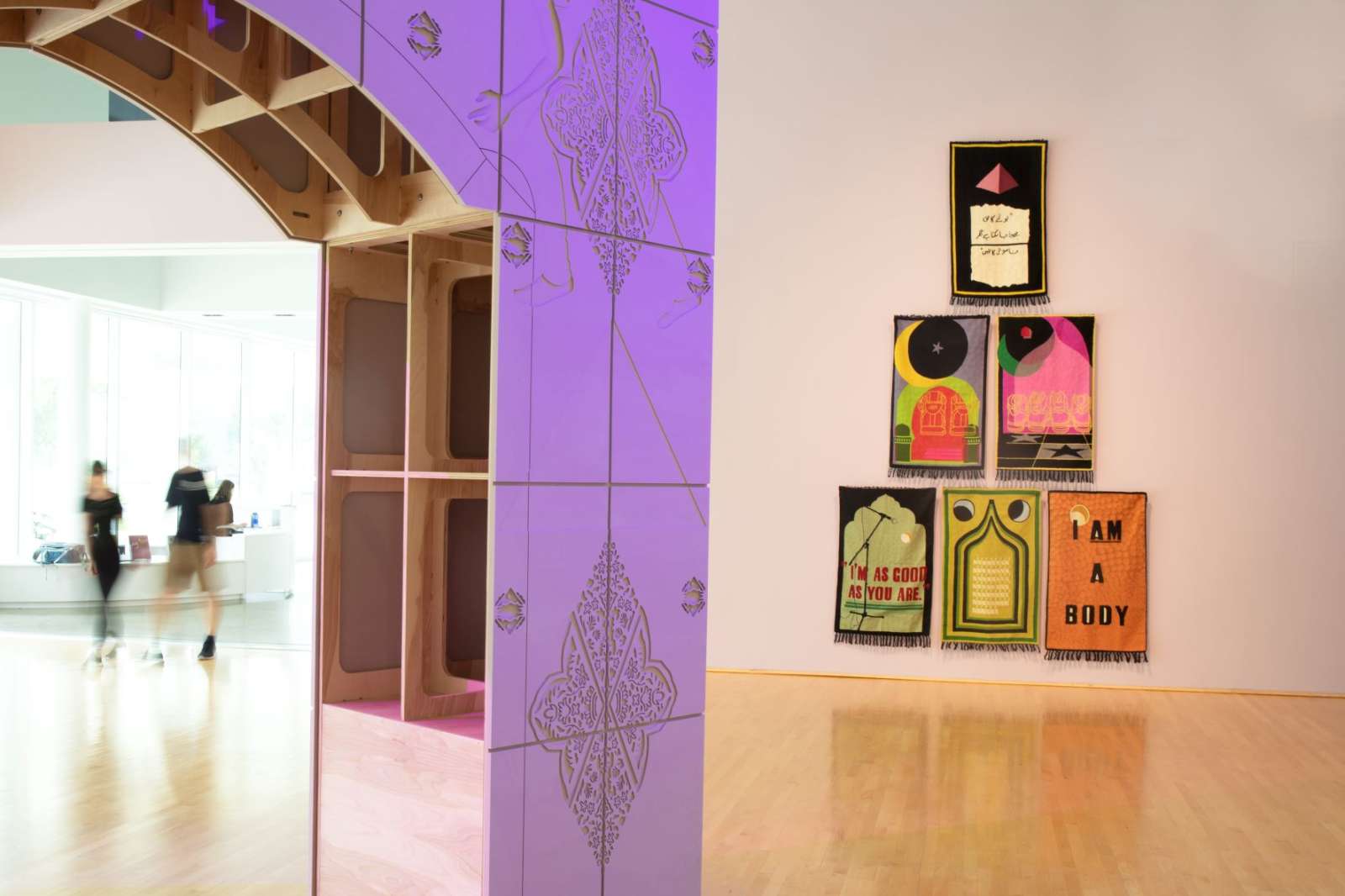 Baseera Khan: Weight on History, installation view, Painful Arc (Shoulder High), detail, and Prayer Rug Series. Photo by Geoff Winningham. 