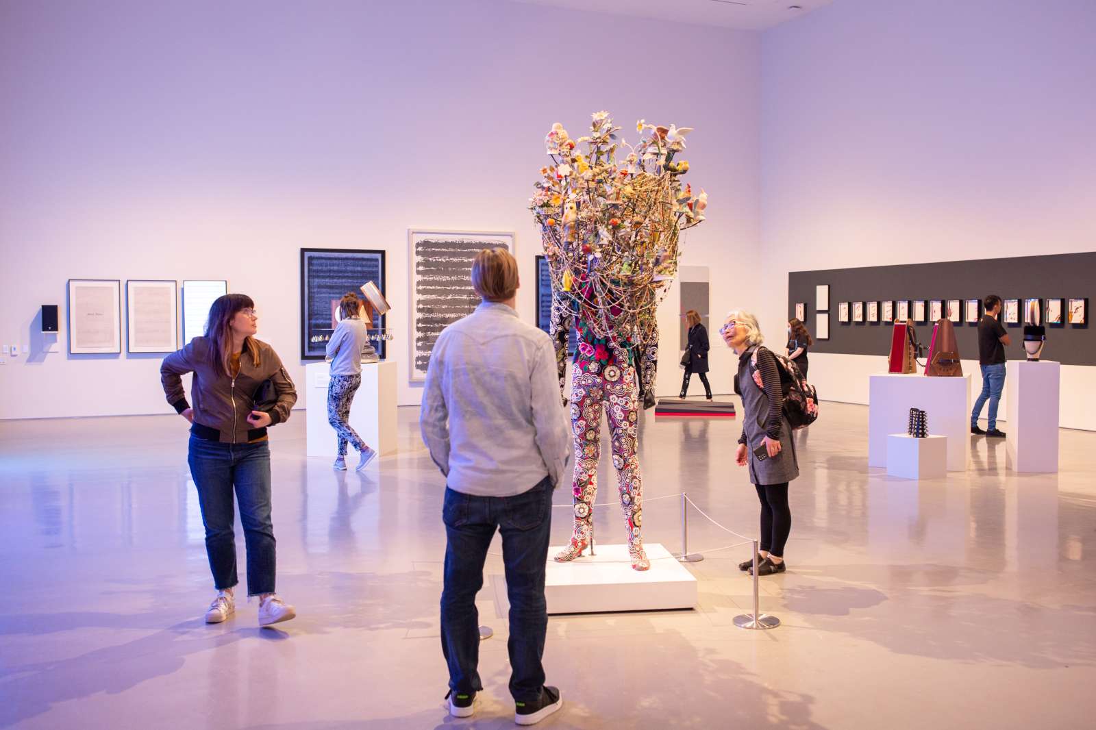 Attendees viewing artwork