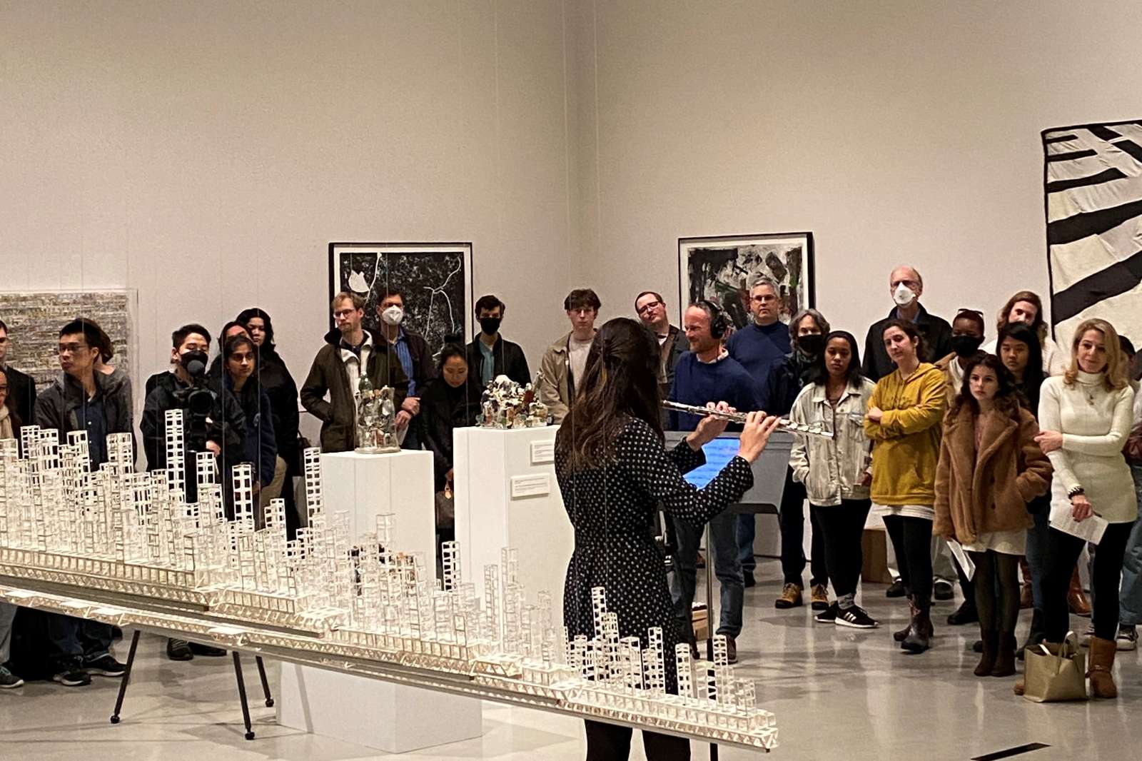 Hannah Tassler, flute, in Brown Foundation Gallery with Katsumi Hayakawa, "Fata Morgana," in foreground. 