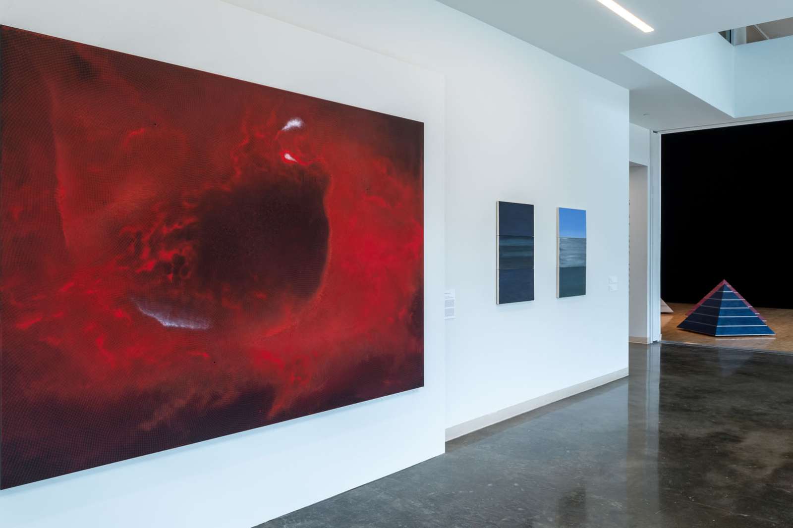 Installation view with painting by Shirazeh Houshiary, 'Flare Up' (2018; foreground), and works by Byron Kim, and Sam Gilliam (background) 