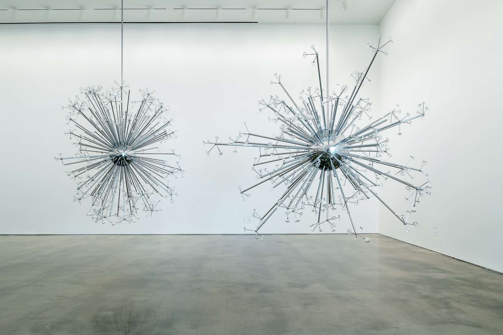 Installation view of Island Universe by Josiah McElheny, 2008. Chrome plated aluminum, handblown and molded glass, electric lighting, and rigging. Dimensions variable. Courtesy the artist. Photo: Nash Baker