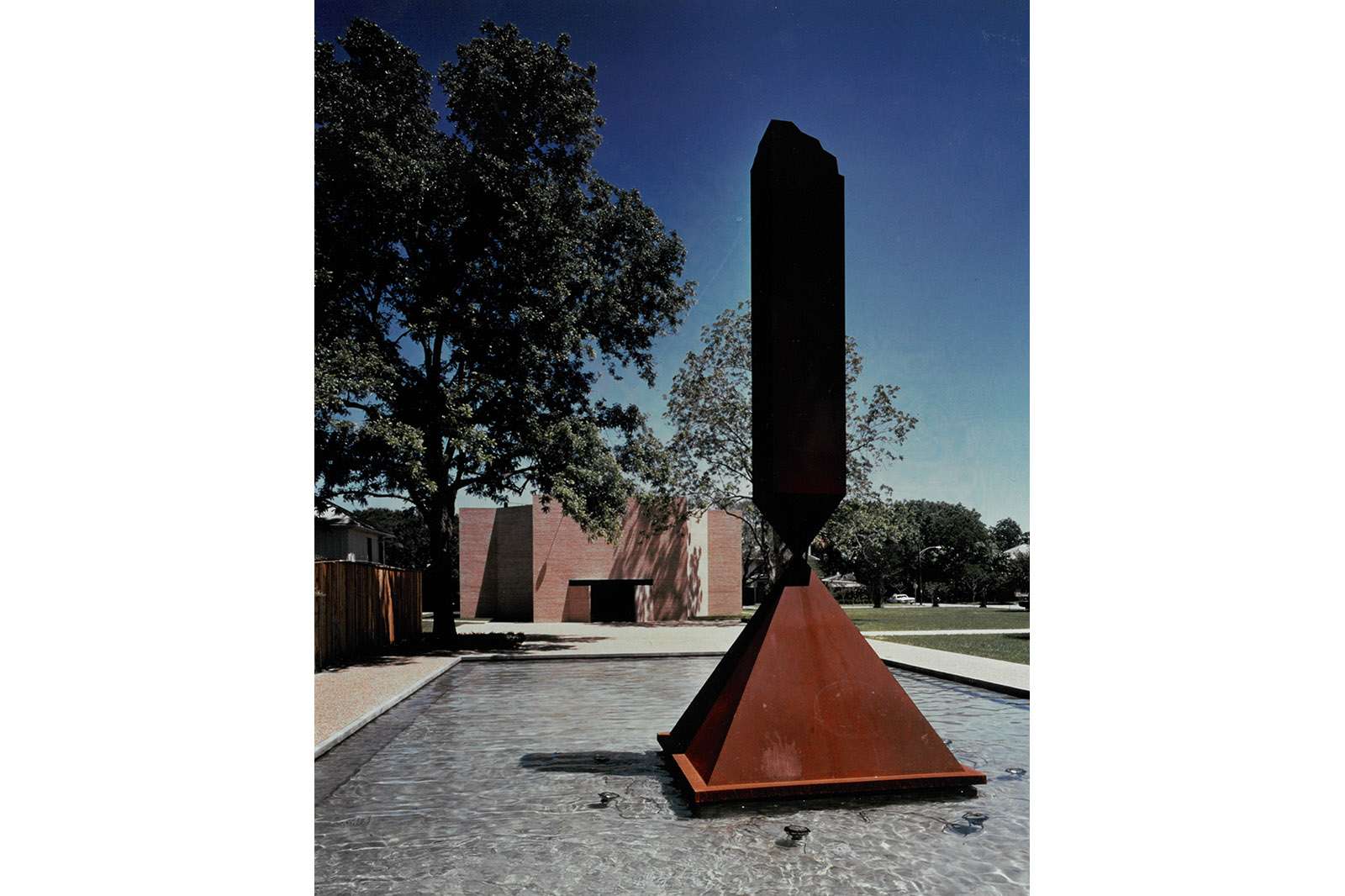 Barnett Newman's 'Broken Obelisk' in front of the Rothko Chapel, 1971. Photo by Hickey-Robertson. Co